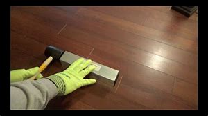 Anita Johnston Demonstrating flooring install