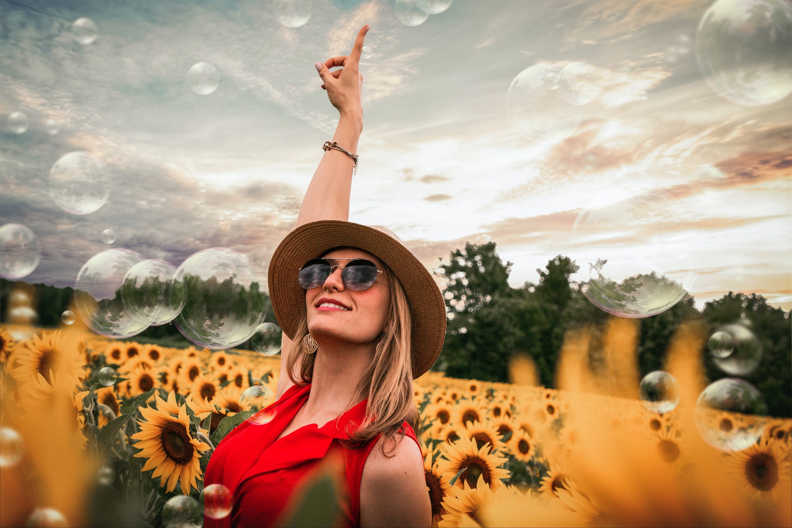 Rising Mortgage Rates, Woman pointing up, Sunflowers, Bubbles, interest Rates